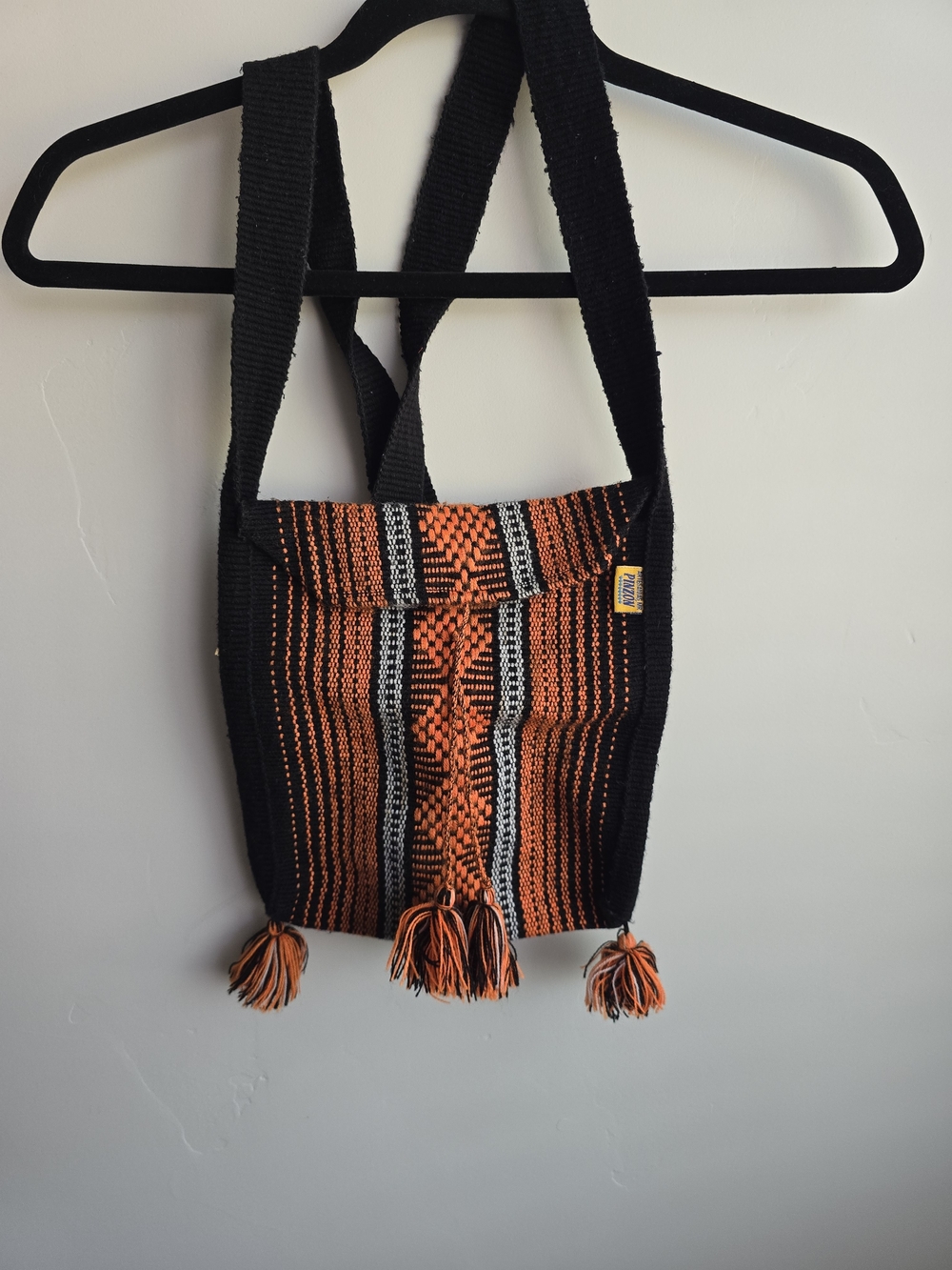 Handwoven Black and Orange Crossbody Bag with Tassels